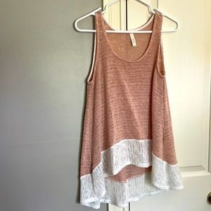 Knit size Medium top. Longer in the back than the front. Very cute!